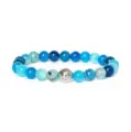 Detailed closeup view of blue agate gemstone bead bracelet with engraved metal spacer. - Blue Agate