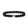 Detail view of 8mm black gemstone beads yoga bracelet featuring a vintage silver charm bead. - Black Labradorite Color