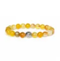 Natural gemstone beaded bracelet detail shot, elegant yellow agate with metal spacer. - Agate Labradorite