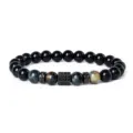 Detailed view of the beaded bracelet showcasing blue tiger eye stones and cubic zirconia spacers. - Style 13
