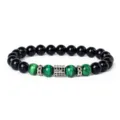 Detailed view of beaded bracelet featuring green tiger eye stones, black beads and zircon spacer. - Style 8