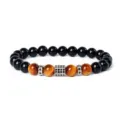 Closeup of beaded bracelet with tiger eye stones, black beads, and sparkling zircon metal spacers. - Style 1