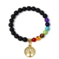 Detail view of 8mm black lava stone chakra bracelet with gold tree of life pendant and gemstones. - 22