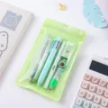 Cute cartoon stationery set with multi-color pens and avocado eraser in green pouch for students. - Avocado 6-Piece / Green
