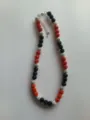 Detailed view of a 10mm rhinestone clay bead shamballa necklace in red, black, and silver. - Color Matched Bracelet (Approx 19cm, ~20 Beads, Elastic Line, No Clasp) / Red, Black and Silver Mix (29)