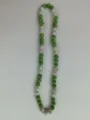 Detailed view of a 10mm green and white Shamballa rhinestone bead necklace and bracelet - Green and Silver White