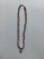 Close-up detail of a stunning 10mm rhinestone clay bead necklace featuring a sparkling cross pendant. - Cross Pendant Style / Color Matched Bracelet (Approx 19cm, ~20 Beads, Elastic Line, No Clasp) / Pink