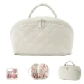 Detailed view showing internal storage of quilted travel cosmetic bag with pouch. - Two-Piece Set / Off White