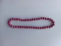 Macro view of pink Shamballa pave clay beads with sparkling rhinestones details. - Pink