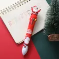 Christmas 10-color retractable ballpoint pen with cute Santa Claus cartoon figurine and festive barrel print. - Santa Claus / 1 Piece/Pack