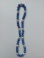 Close-up of blue and white Shamballa necklace featuring sparkling rhinestone clay beads - Dark Blue, Silver & White