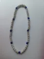 Detailed view of a Shamballa necklace featuring sparkling blue and white pavé beads. - 186 / Approx. 44 Beads, Approx. 51cm (20 Inches)