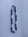 Detailed view of the black and white rhinestone Shamballa bead necklace with metal clasp. - Black and White Shamballa Rhinestone Style (21) / Necklace approx 16 inches (approx 40cm) / Black and White