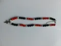 Detail view of the shamballa rhinestone bead necklace featuring a cross pendant and clasp. - Color Matched Bracelet (Approx 19cm, ~20 Beads, Elastic Line, No Clasp) / Black, Orange and Silver (64)