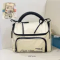 Large waterproof cream travel makeup bag with black handle and size measurements. - 26.5*13*20cm / Beige