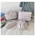 Detailed view showing the quilted floral 4-piece cosmetic bag set on a vanity desk - Large (25*16*16CM) / Purple Rose