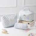 Three-piece quilted cotton floral cosmetic bag set featuring blue and white patchwork patterns - Patchwork Floral Indigo