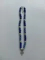 Detailed view of blue and silver Shamballa bead necklace with rhinestone cross pendant - Cross Pendant Style / Color Matched Bracelet (Approx 19cm, ~20 Beads, Elastic Line, No Clasp) / Blue and Silver White