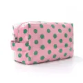 Close-up of a pink travel makeup bag featuring green polka dots and a side handle - Pink Polka Dots / 20*10*12.5cm