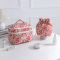 Floral quilted makeup bag set including hand bag and drawstring pouch on white desk - Rose Red on White