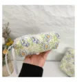 Close-up detail showing the quilted texture and floral pattern of the cotton cosmetic bag - S / 19x7x6cm / Green Flower