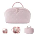 Detailed view of large capacity pink quilted travel makeup bag with interior compartments - Two-Piece Set / Pink