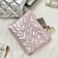 Pink quilted heart cosmetic bag and organizer with metallic finish in a flat lay - Heart Pink