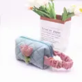 Detail of blue corduroy cosmetic bag with pink tulip patch and ruffled handle - S / Light Blue