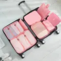 8-teiliges rosa Reise-Organizer-Taschen-Set ordentlich in einem Koffer angeordnet. - Haken 8-Teiliges Set / 8-teiliges Set / Rosa