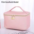 Premium pink Saffiano PU leather makeup bag featuring gold zippers and a top handle - Handbag Style / Pink