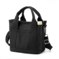 Minimalist black canvas tote bag with adjustable shoulder strap and large capacity - Crossbody Style / Black / S