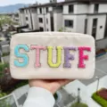 Portable beige nylon cosmetic bag with colorful chenille STUFF letter embroidery - Milky White