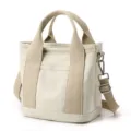 Minimalist cream canvas tote bag with beige straps for daily commute - Crossbody Style / Khaki / S