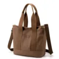 Large brown canvas tote bag for daily commuting with durable handles and shoulder strap - Crossbody Style / Brown / L