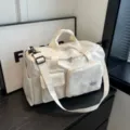 Off-white sports duffel bag for gym and travel featuring multiple storage compartments - Off White