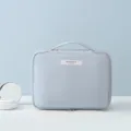 Light blue portable cosmetic storage bag with minimalist handle and zipper closure - L / Fog Blue