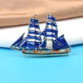 Close-up detail of a vintage navy style enamel sailing ship brooch with deep blue sails - Large Sailing Ship