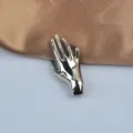 Elegant silver-tone hand-shaped brooch with a high-gloss polished metallic finish - Single Hand Style / Silver
