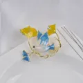 Detailed close-up of a decorative enamel peace dove and ginkgo leaf brooch pin - Peace Dove Shape (240910-LX03)