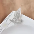 Elegant matte silver flying peace dove brooch pin with black eye detail for unisex - Silver