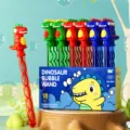 Cartoon Dinosaurier Seifenblasenstab Spielset für Kinder, Handheld Seifenblasenmaschine Box. - Dinosaurier Seifenblasenstab