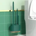 Wall-mounted dark green toilet brush three-piece set with holder for bathroom cleaning. - Three-Piece Set / Dark Green