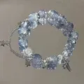 Detailed view of the stylish glass bead bracelet featuring cute metal star charms and chain. - Meteor Bracelet (S6231) / Dark Blue