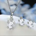 Silver plated cute turtle necklace and earrings set with sparkling cubic zirconia stones. - White