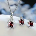 Exquisite silver-tone turtle pendant necklace and red cubic zirconia earrings set. - Red
