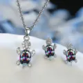 Silver-plated turtle necklace and earrings set with iridescent crystal and sparkling stones. - Colorful