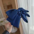 Elegant navy blue satin oversized bow headband with thin frame for stylish hair styling - Navy Blue