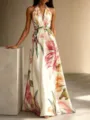 Floral halter maxi dress with open back and large hem for elegant resort vacation style. - S / Apricot