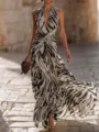 Elegant black and white zebra print halter pleated maxi dress for summer resort fashion. - S / Dresses / Multicolor
