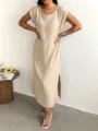 Detail view of the solid beige sleeveless midi dress featuring a side slit and relaxed fit. - XS / Apricot